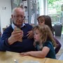 Looking at a stag beetle with grandchildren kew 2019