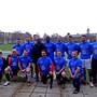 Len captains Team MND in a football game against a squad from the APPG on Football