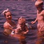 Barb in the water with daughter Rina and stepson Ken