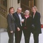 Receiving his MBE with Anna and two daughters