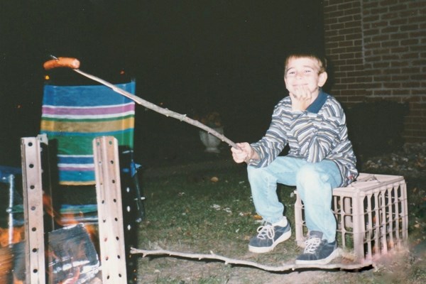  William roasting hotdogs in the backyard - October 1998