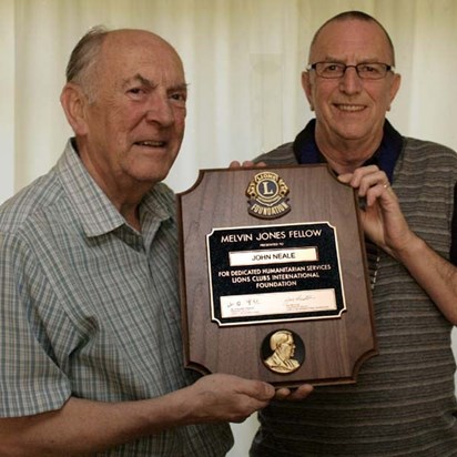 Lion John Neale  Being presented with his Lions Melvyn Jones Fellowship by Lion President Alan