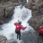 Mommy jumping in before climbing waterfall