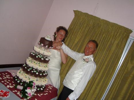 Us cutting our wedding cake November 2008