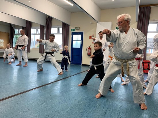 Dad teaching his grandson and granddaughter- Summer 2019