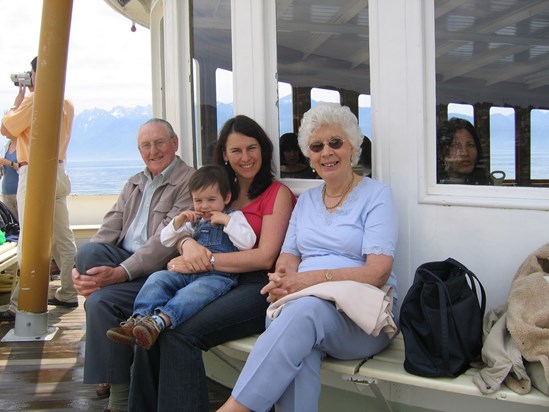 Proud Mum with Dan and her much loved grandparents, Ian and Hazel on Lake Geneva in 2004