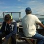 Bill, driving boat, fishing with Matt and Kevin Gelinas